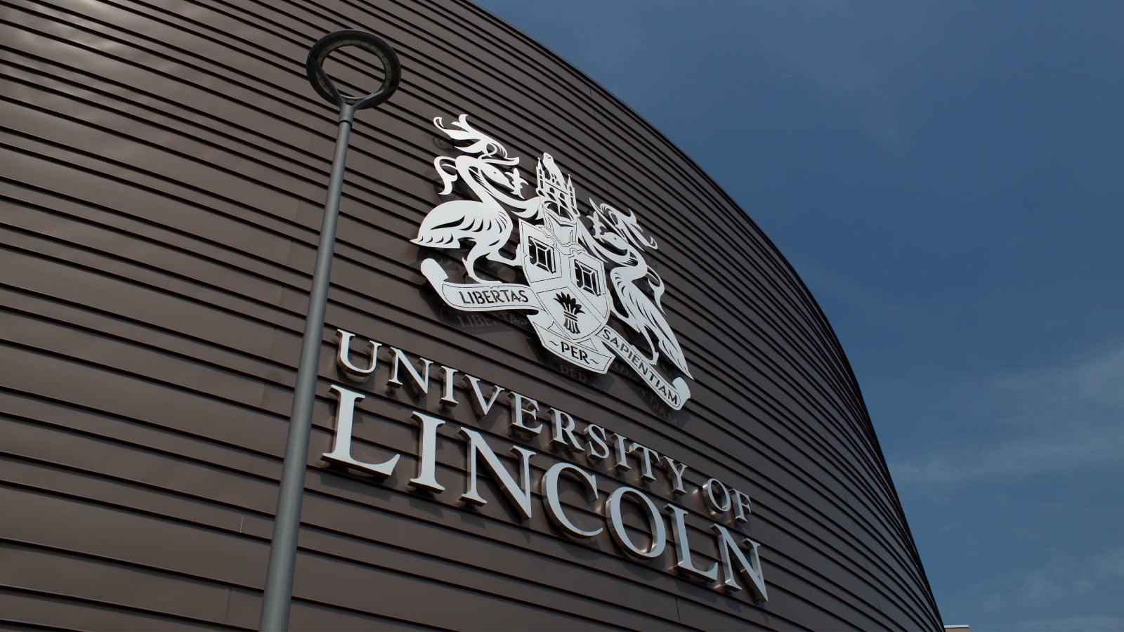 University of Lincoln crest and signage on a campus building