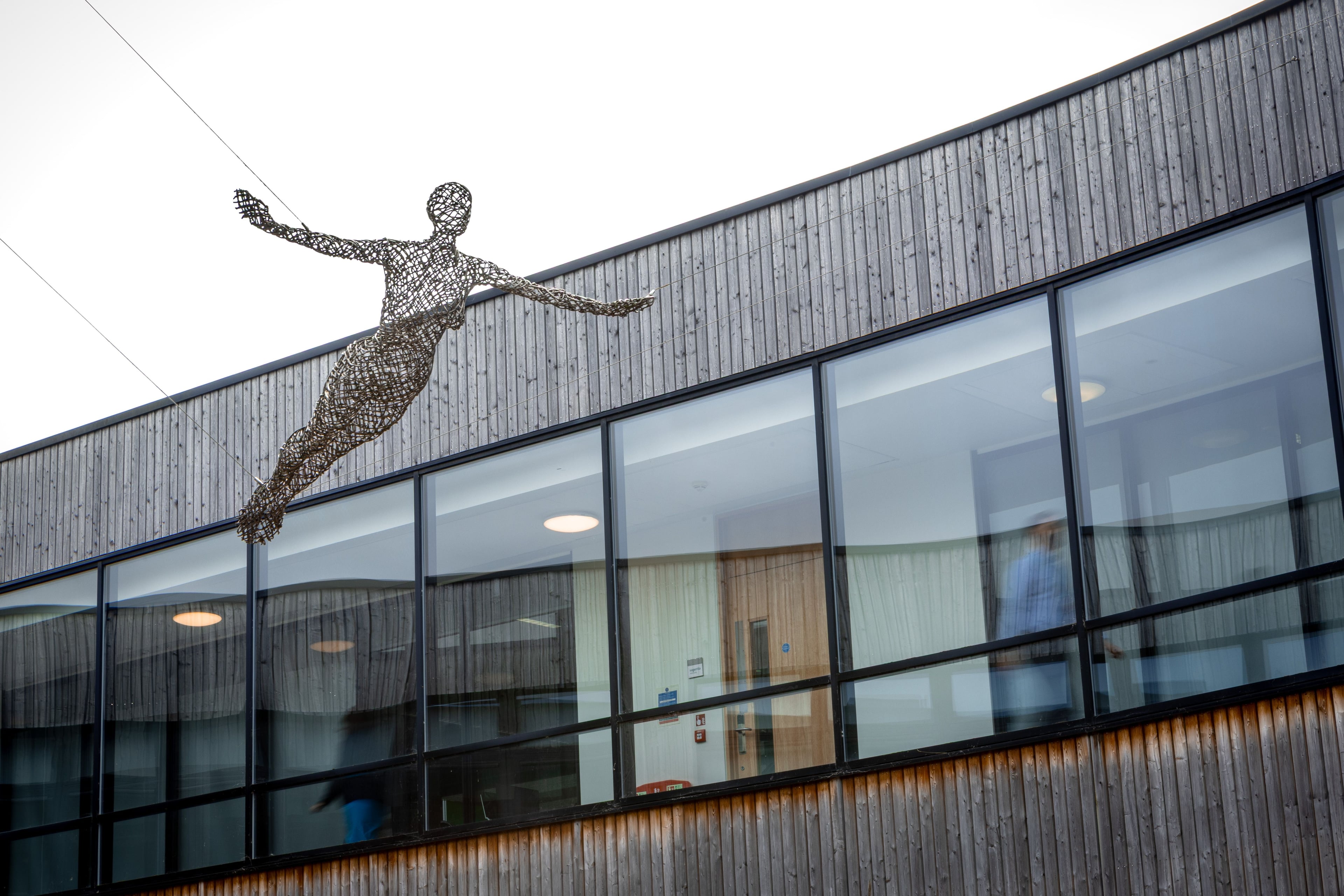 Picture of office building with decorative statue